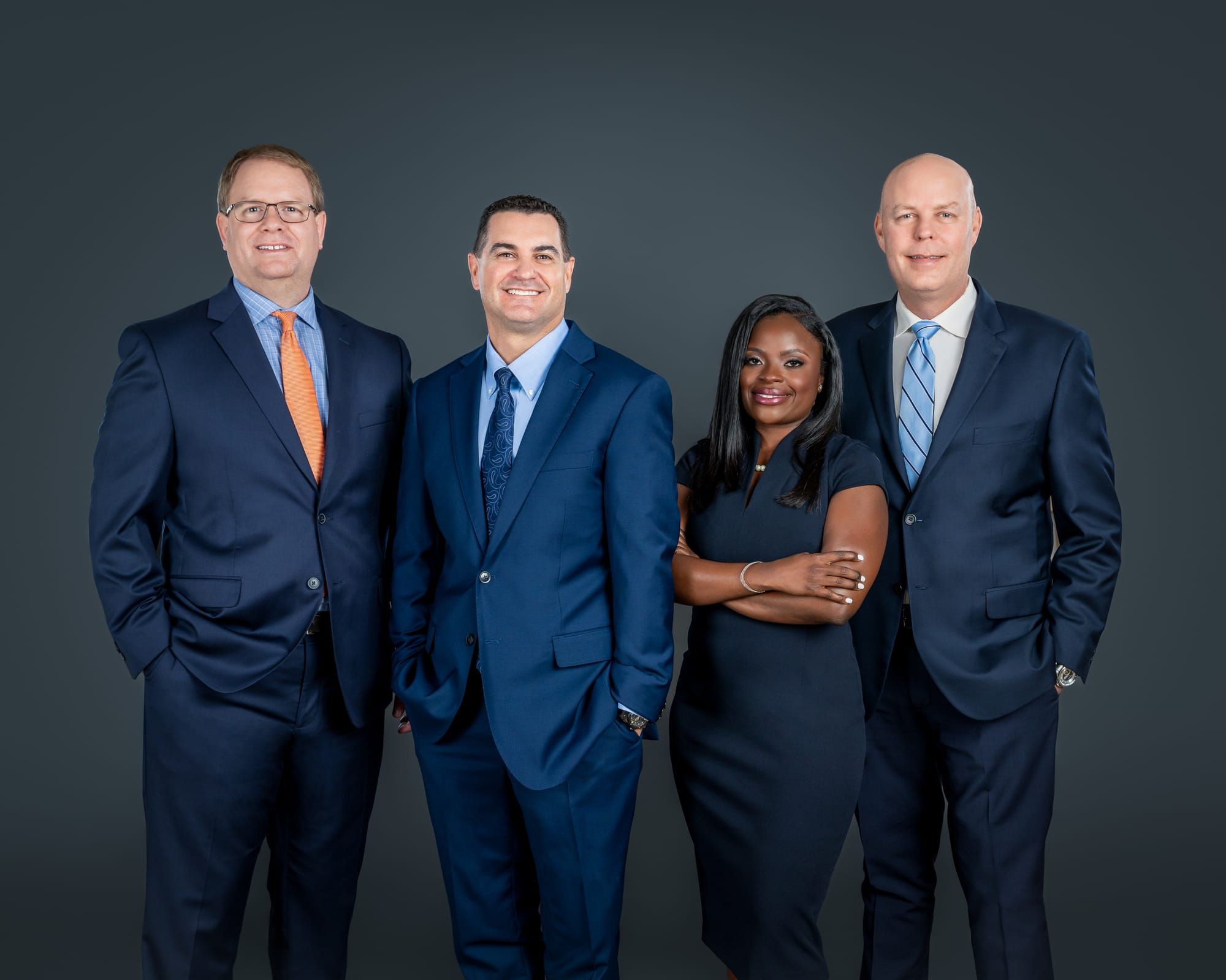 The attorneys of Lyle B. Masnikoff & Associates in navy suits