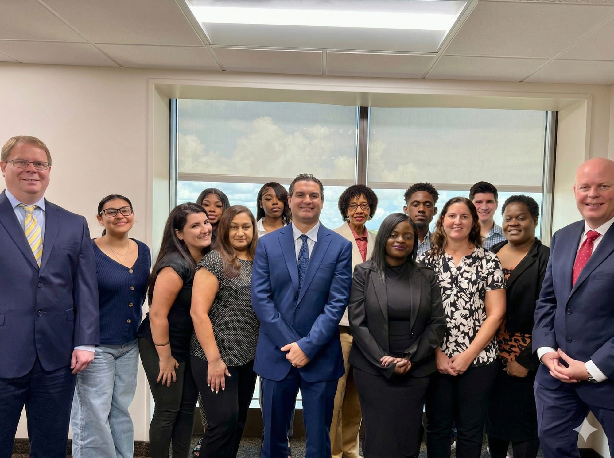 Lyle B. Masnikoff with the firm’s attorneys and staff at the office